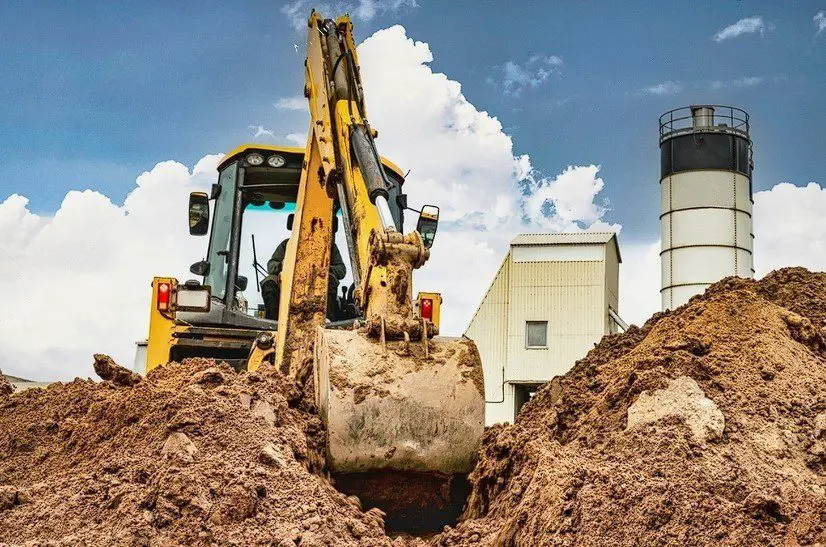 Earthworks at a construction site, Modern earthmoving equipment